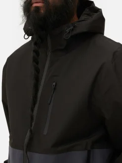 Chubasquero Con Varios Bolsillos Y Bloques De Color