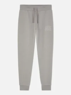 Pantalones De Chándal Pitillo Con Estampado Gráfico