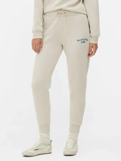 Pantalones De Chándal Pitillo Con Estampado Gráfico