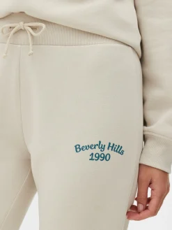 Pantalones De Chándal Pitillo Con Estampado Gráfico