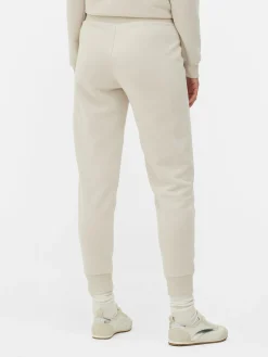 Pantalones De Chándal Pitillo Con Estampado Gráfico