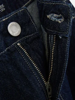 Vaqueros De Pernera Ancha Con Bajos Vueltos